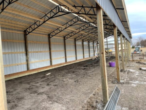 The inside of a barn under construction.